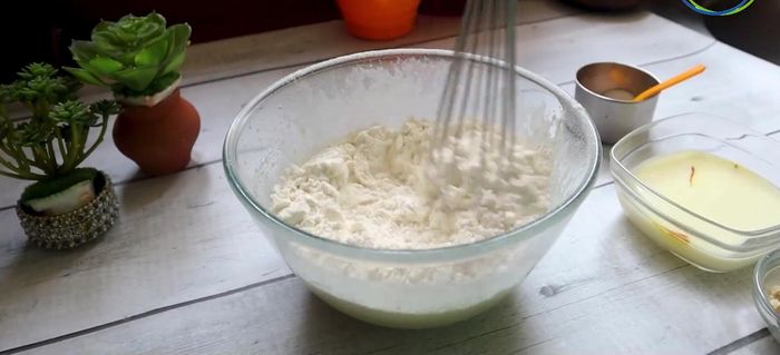 Gradually add the dry ingredients to the wet ingredients, mixing gently until just combined.