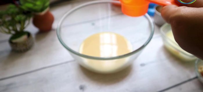 Combine condensed milk, olive oil, and vanilla essence in a bowl. Mix well until homogeneous.