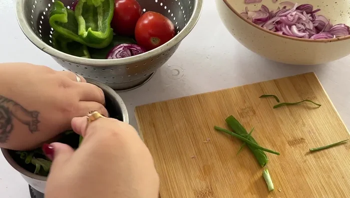 Roughly chop spring onions, red bell pepper, tomatoes, and rosemary. Blend these ingredients together (may need to blend in batches).