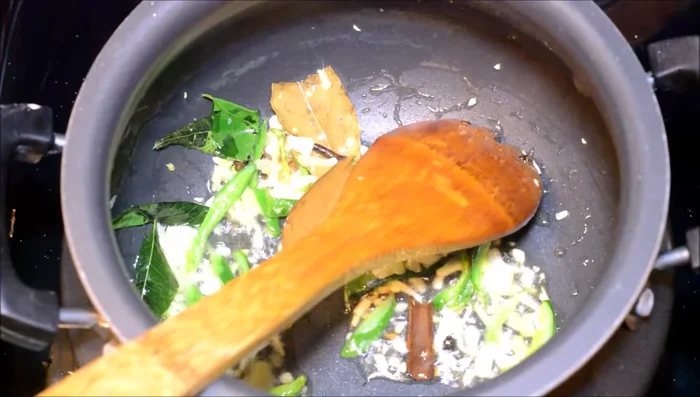 Add thinly sliced onions and saute with a pinch of salt until translucent.