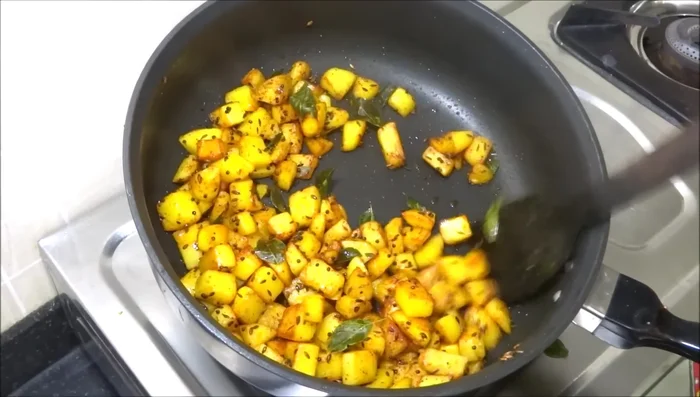 Check if potatoes are cooked through and crispy. Turn off the gas. If needed, cook for another 2 minutes covered.