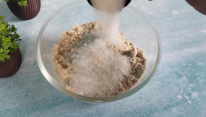 Add sugar and mix thoroughly. Do not grind the sugar.