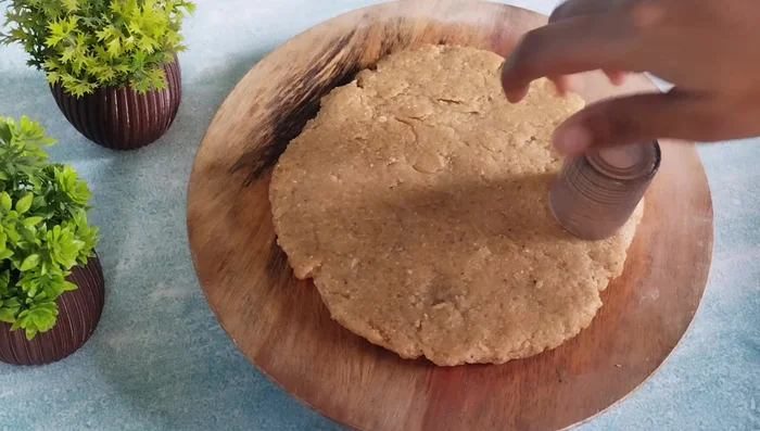 Use a cookie cutter or lid to cut out round biscuits. You can also use a knife and make any shape you like.