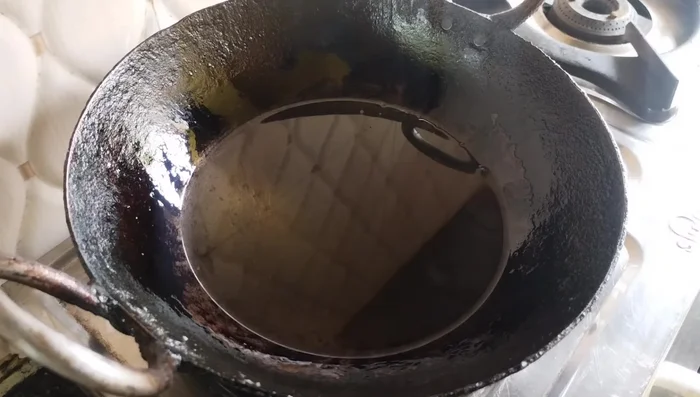 Heat oil in a pan until smoking hot.