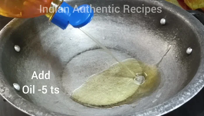 Now add turmeric powder, chili powder, and coriander powder. Saute for a minute.