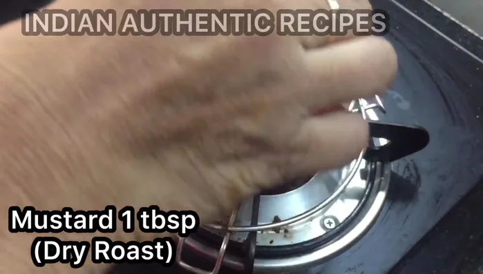 Heat oil in a frying pan. Add mustard seeds, and let them splutter.