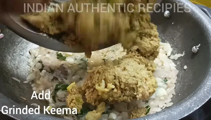 Add the spice blend to the mutton and continue cooking until the meat is tender. (This step is implied, exact timing not available in transcript)