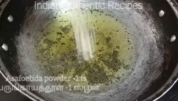 Heat sesame oil in a pan, add mustard seeds and fry until they splutter.