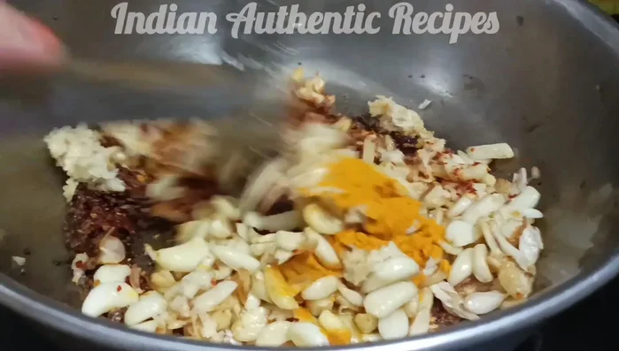 Add the remaining roasted garlic, salt, and fresh tamarind juice. Mix well and bring to a boil.