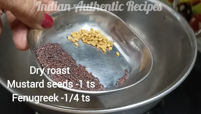 Dry roast the garlic in a frying pan. Add mustard seeds and fenugreek seeds; fry until browned.