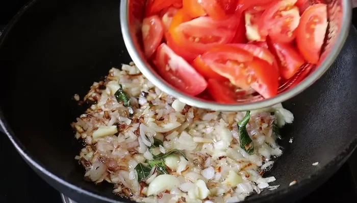Add chopped onions, ginger, garlic and green chilies. Saute until the onions turn translucent.