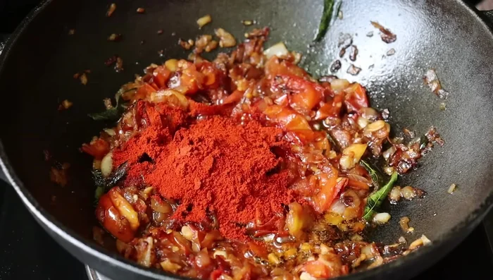 Add chopped tomatoes and saute until they soften.