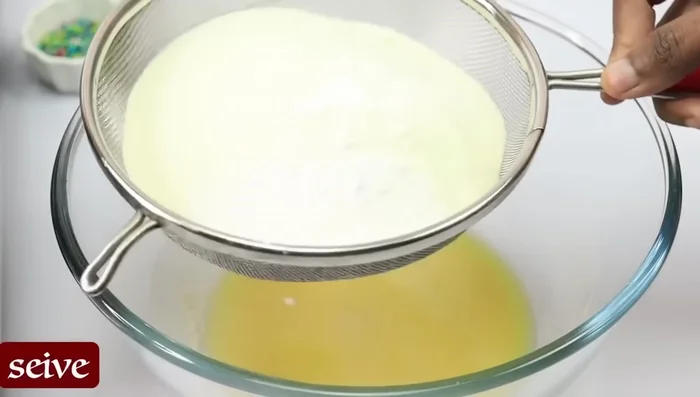 Add the fried balls to the sugar syrup.
