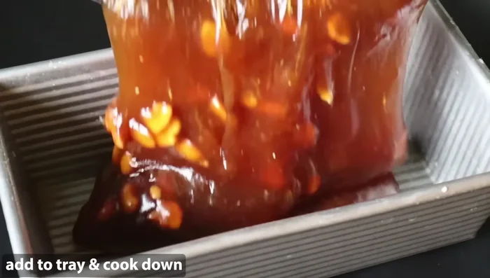 Add water gradually, continuously stirring to prevent lumps and achieve the correct consistency. (Details on amount of water and consistency are not explicitly provided in the transcript)