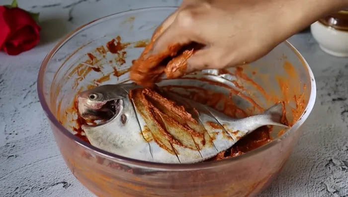 Marinate the fish in the spice mixture.