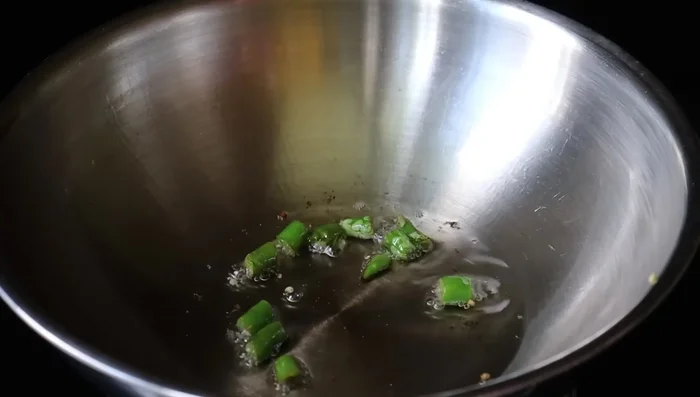 Heat oil in a pan.
