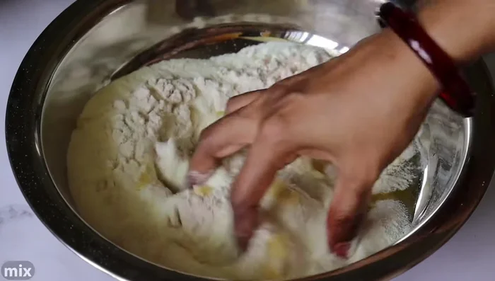 Begin preparing the ingredients and dough.