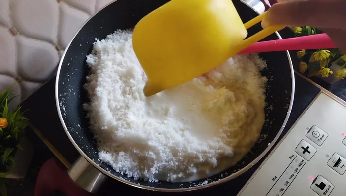 Add 2 cups of milk (with or without cream) and mix well. Stir continuously on medium flame until the milk thickens.