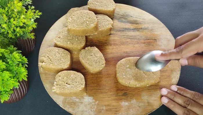 Optionally, add a design to the top of each biscuit using a spoon or mold.