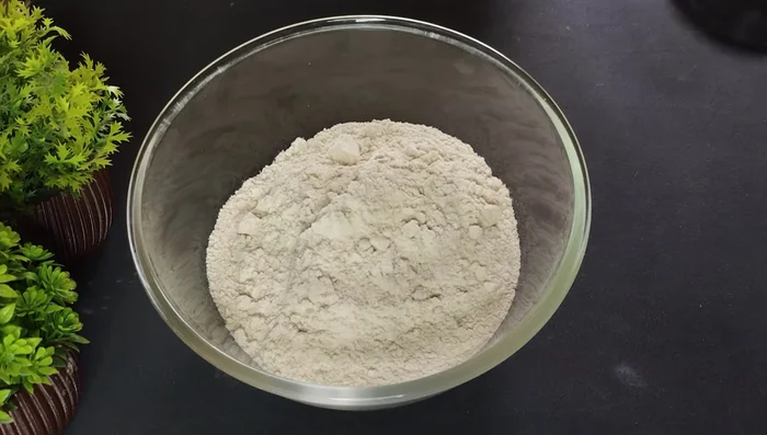 Add 1/2 cup desiccated coconut powder (you can use white desiccated coconut too).