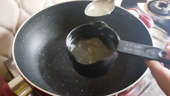 Heat ghee in a pan. Add dry fruits (cashew nuts, almonds, raisins, and dry coconut) and fry lightly until golden brown.