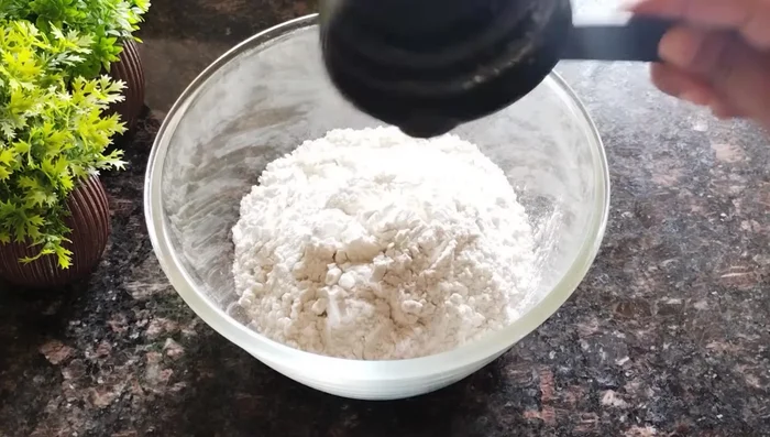 In a bowl, mix together all-purpose flour, salt, celery seeds, and baking powder.