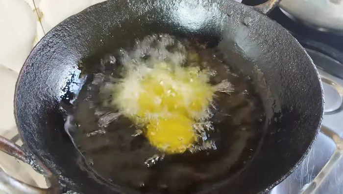 Fry the sweets: Heat oil in a pan. Fry the semolina balls on low heat until they float, double in size, and turn golden brown. Do not overcrowd the pan.