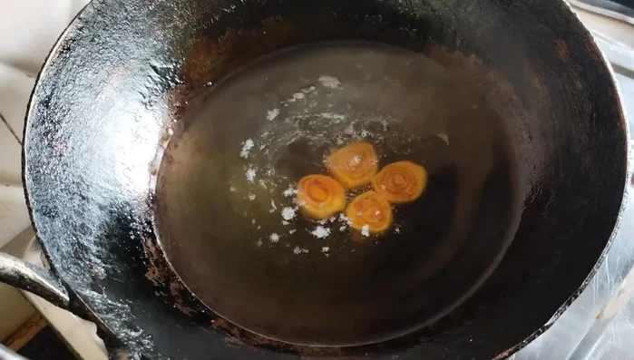 Fry the Bhakarwadi: Heat oil in a pan. Fry the Bhakarwadi on low flame until golden brown. Drain on paper towels.