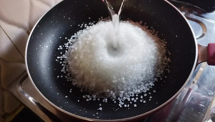 Prepare the syrup: Combine 1 cup sugar and 1/2 cup water in a pan. Cook over low heat for 5-6 minutes until the sugar dissolves and forms a sticky syrup (no strings).