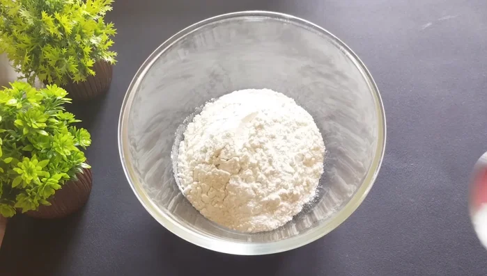 In a bowl, mix refined flour, salt, celery, and oil. Rub the oil into the flour until it resembles breadcrumbs.
