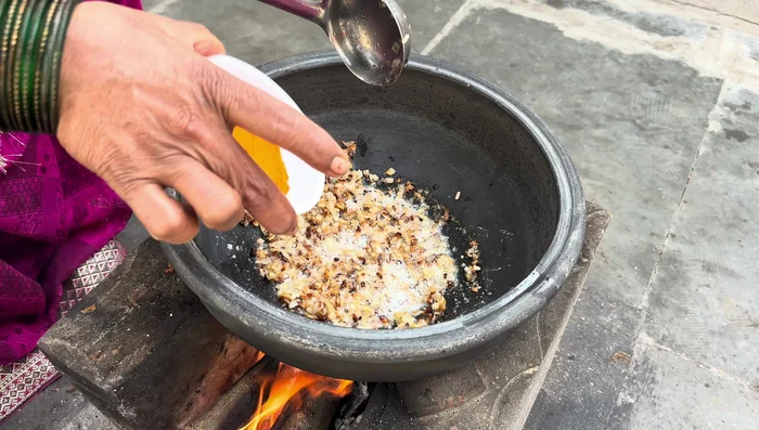 Add Malvani masala, Kashmiri red chili, and salt to the pan.