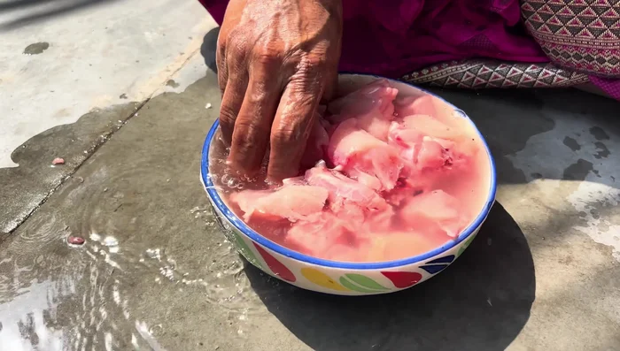 Wash the chicken thoroughly with two changes of water.