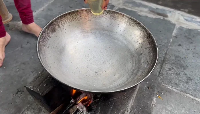Heat oil in a pan for frying. Once hot, carefully add the suran finger chips.