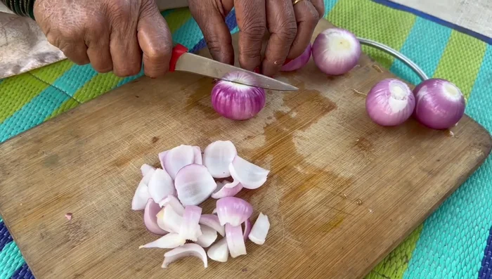 Cut onions into four parts, then separate into petals.