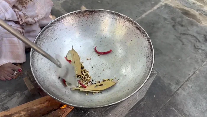 Roast cardamom and peppercorn until dry. Remove spices and set aside.