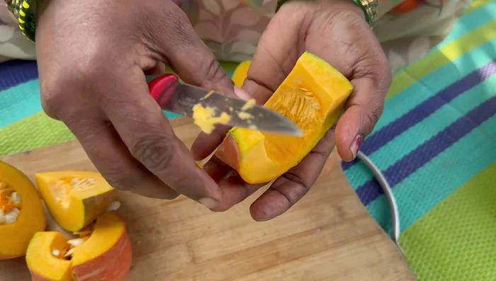 Cut the pumpkin into two parts, then into small pieces. Remove the seeds and skin.
