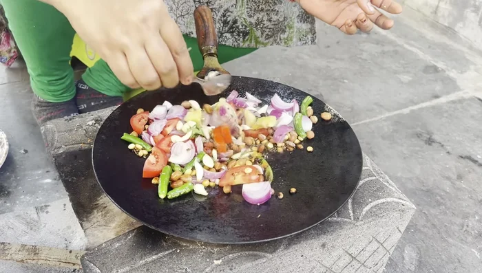 Add remaining chutney ingredients: Add ginger, garlic, red chilies, coriander, and asafoetida to the pan and fry.