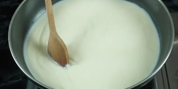 Bring the milk to a boil over medium heat, stirring constantly.