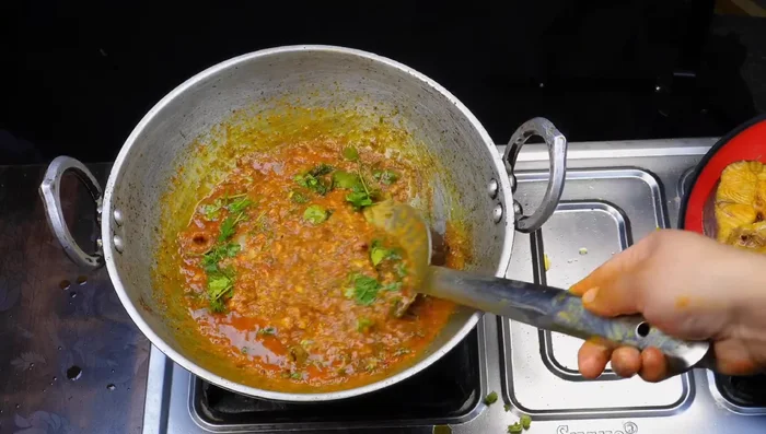 Cook the fish curry.