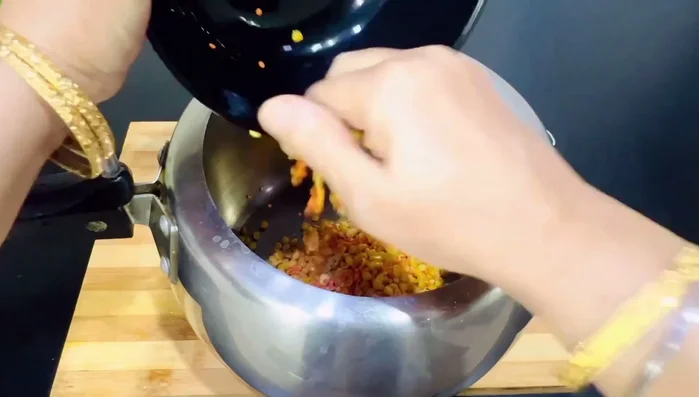 Cook the dals in a cooker with one tomato, one green chili, 1-2 garlic cloves, a small piece of ginger, 1/4 teaspoon salt, 1/4 teaspoon turmeric powder, and water (about 1 inch above the dal). Add some oil or ghee. Cook for 8 minutes after one whistle on low flame.