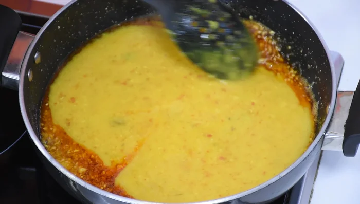 Add the tadka to the dal.