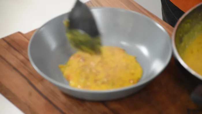 For the final garnish: Heat butter in a pan. Add asafoetida and red chillies.