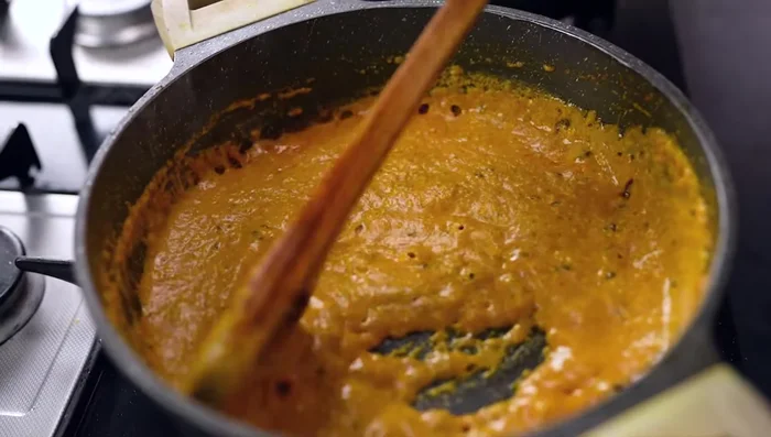 Cook the tadka for 4-5 minutes until the oil separates. Remove the spice bundle from the dal.