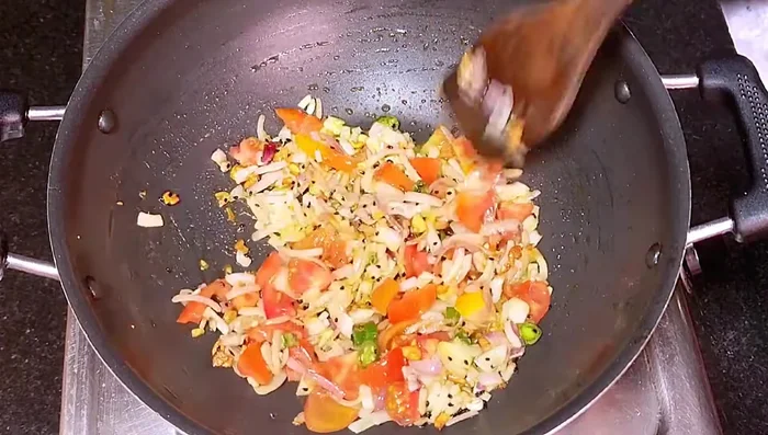 Add tomatoes and fry for 3-4 minutes until the raw smell is gone.