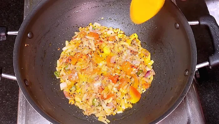 Add salt, turmeric powder, and Kashmiri red chili powder. Fry until the tomatoes melt.