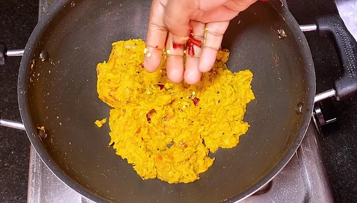 Add fried dry chilies and chopped coriander leaves.