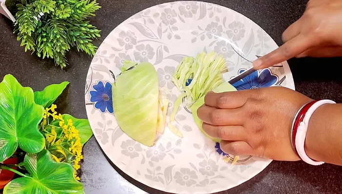 Cut the cabbage into small pieces. You can use a knife or a food processor.
