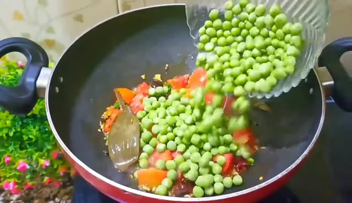 Add peas and fry for a while.