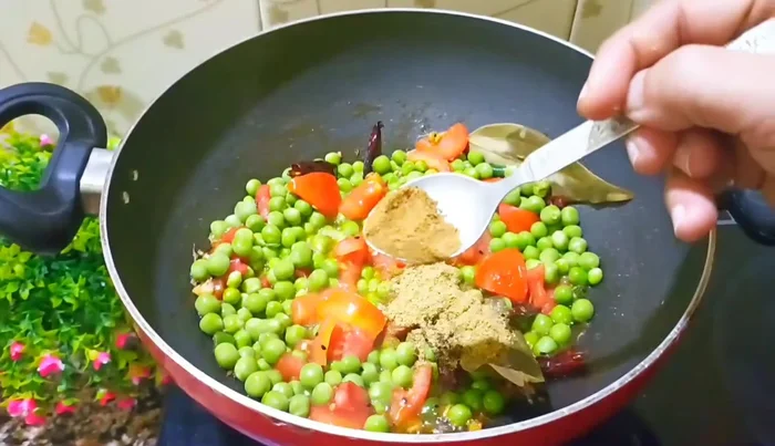 Add coriander powder, cumin powder, and turmeric powder. Mix well.