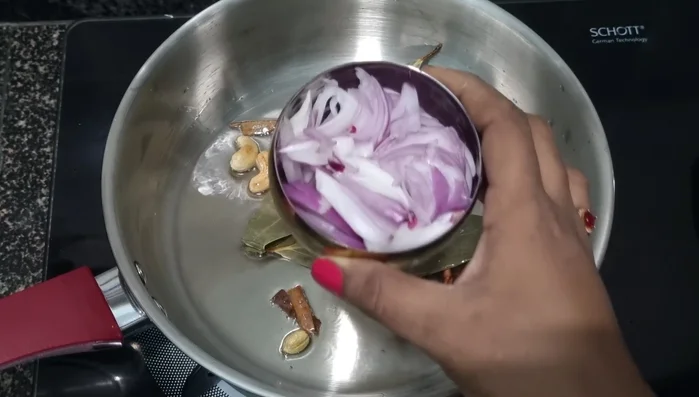 Add chopped onion and a pinch of salt (to help it cook faster). Fry until softened.